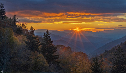 sun rising over mountains