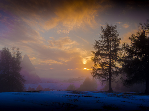 sunset behind alpine scene