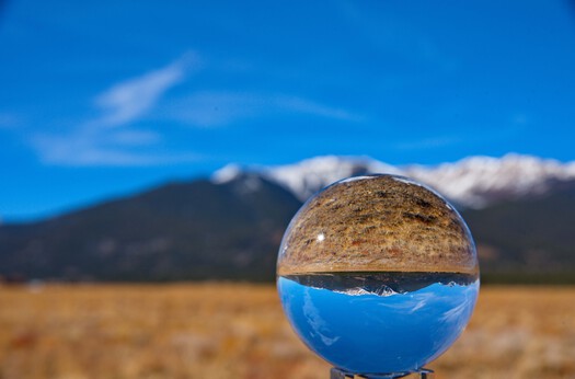 crystal ball and mountain range