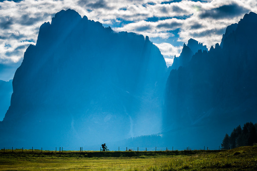 Bicycle on Flat Ground Beneath Huge Mountain
