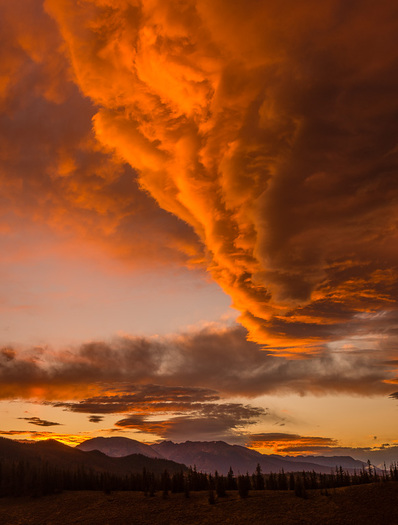 coulds over distant mountains at sunset