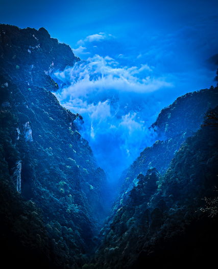 canyon filled with bluish clouds