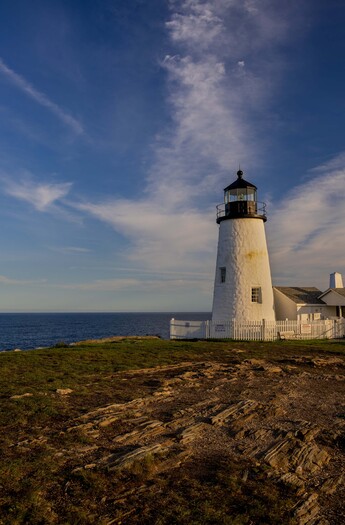lighthouse next to the ocean
