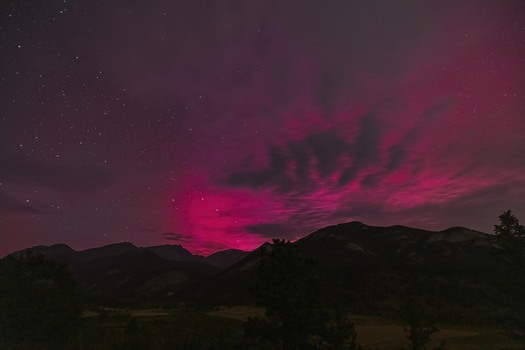 Red nighttime sky over mountains