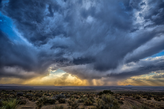 Dry landscape with an approaching storm