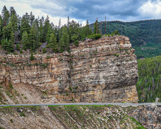 Horizontal layers of rock forming a cliff