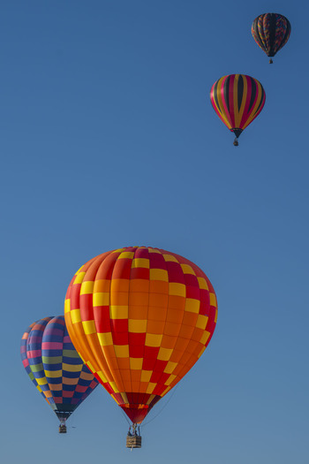 Four colorful hot air ballons.